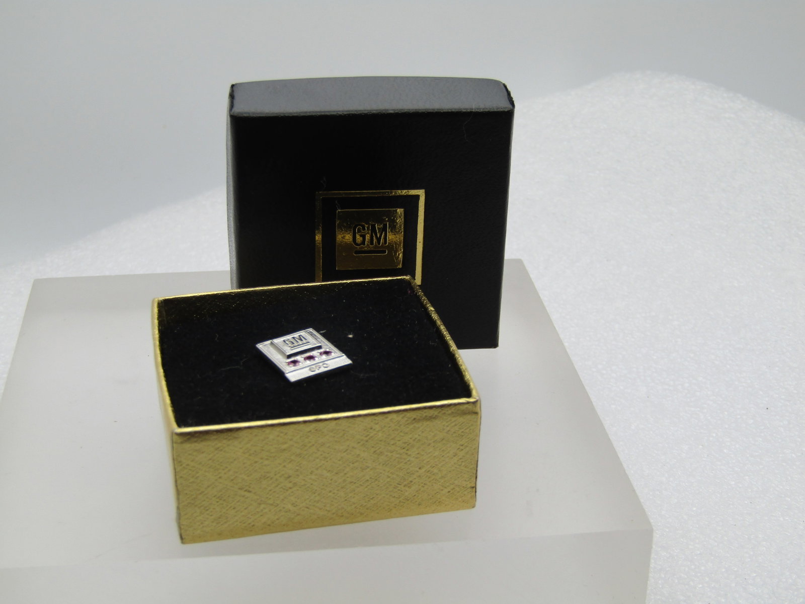 Vintage 10kt G.F. Ruby GM SPO Tack Pin, In Original Box: Vintage 10kt G.F. Ruby GM SPO Tack Pin, In Original Box. This is white gold filled and marked 1/10 10kt. It has a maker's mark that cannot be read. The tie tack has three 1.5mm round rubies - likely l