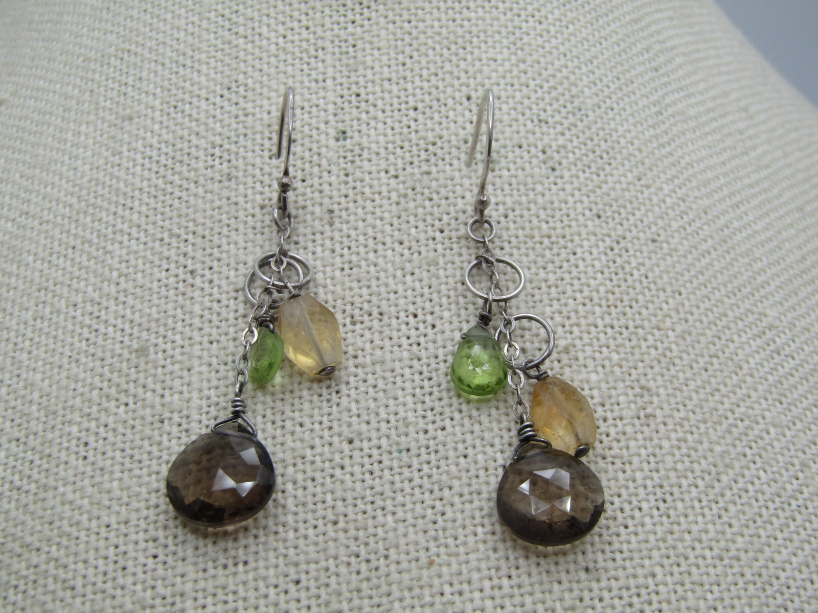 Vintage Sterling Topaz, Citrine, Peridot Earrings, Pierced/Drop, 1980's-1990's: Vintage Sterling Topaz, Citrine, Peridot Earrings, Pierced/Drop, 1980's-1990's. These test as sterling and are marked sterling. Weight is papx. 2.76 gr. They are 1.75" long with a smoky topaz that is