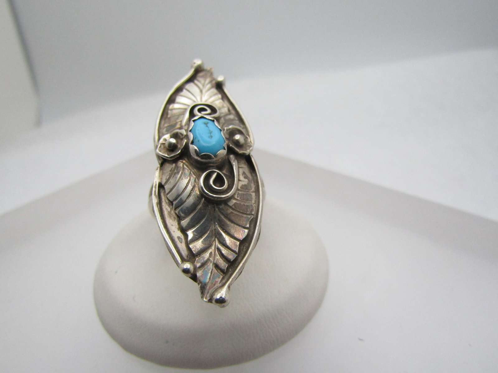 Vintage Sterling Southwestern Turquoise Ring, Long, Sz. 6.5, Signed E, 1970's-1980's: Vintage Sterling Southwestern Turquoise Ring, Long, Sz. 6.5, Signed E, 1970's-1980's. 1.75" long down the finger and appx. 5/8" wide. It has an oval turquoise nugget that is appx. 8mm long and 4mm wid