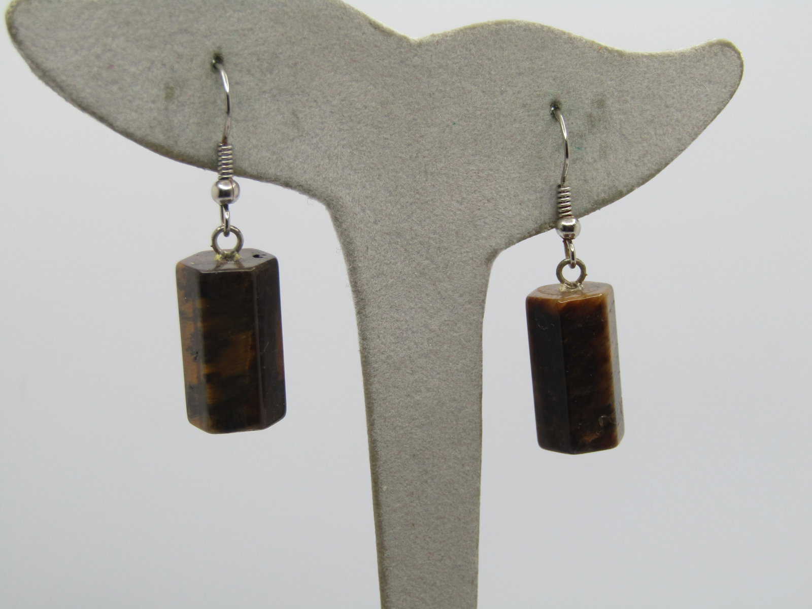 Vintage Tiger's Eye Pierced Earrings, Six Sided Drops, 1970's-1980's: Vintage Tiger's Eye Pierced Earrings, Six Sided Drops, 1970's-1980's. 1Southwestern vibe. .5" long from the curve in the silver tone hook post. the tiger's eye stones are angled and six-sides and