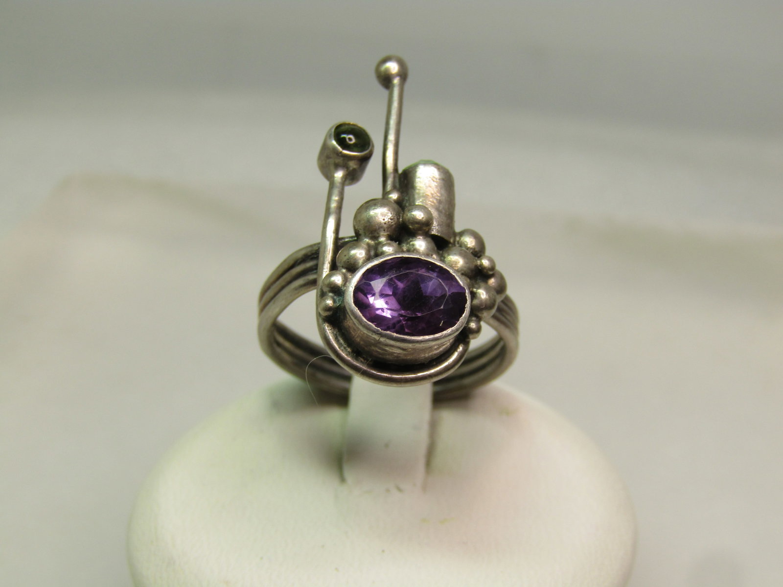 Vintage Sterling Amethyst Peridot Ring, Modernist, Sz. 8, 1980's: Vintage Sterling Amethyst Citrine Ring, Modernist, Sz. 8, 1980's. The band is a triple ridged fuse band that is appx. 3.5mm wide. There is an oval amethyst that is bezel set and appx. 7.5mm by 6mm