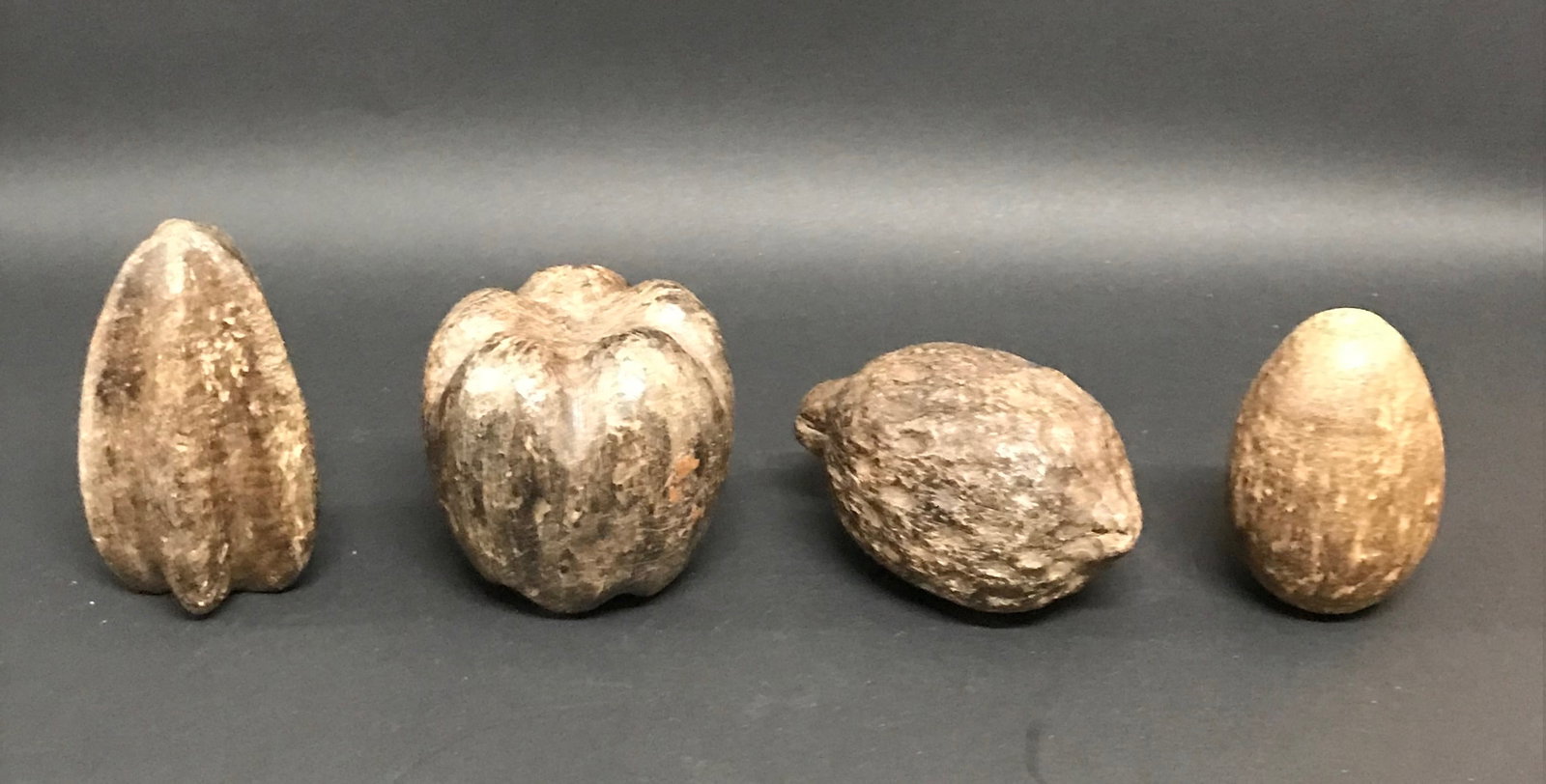 Carved Wood Assorted Fruits Sculpture Lot of 4: Title: Carved Wood Assorted Fruits Sculpture Lot of 4 Description: Folk Art Carved Wood Assorted Fruits Sculpture Lot of 4 Date/Period: Late 20th Century Materials: Wood Size: 2" h x 4" w Reserve: