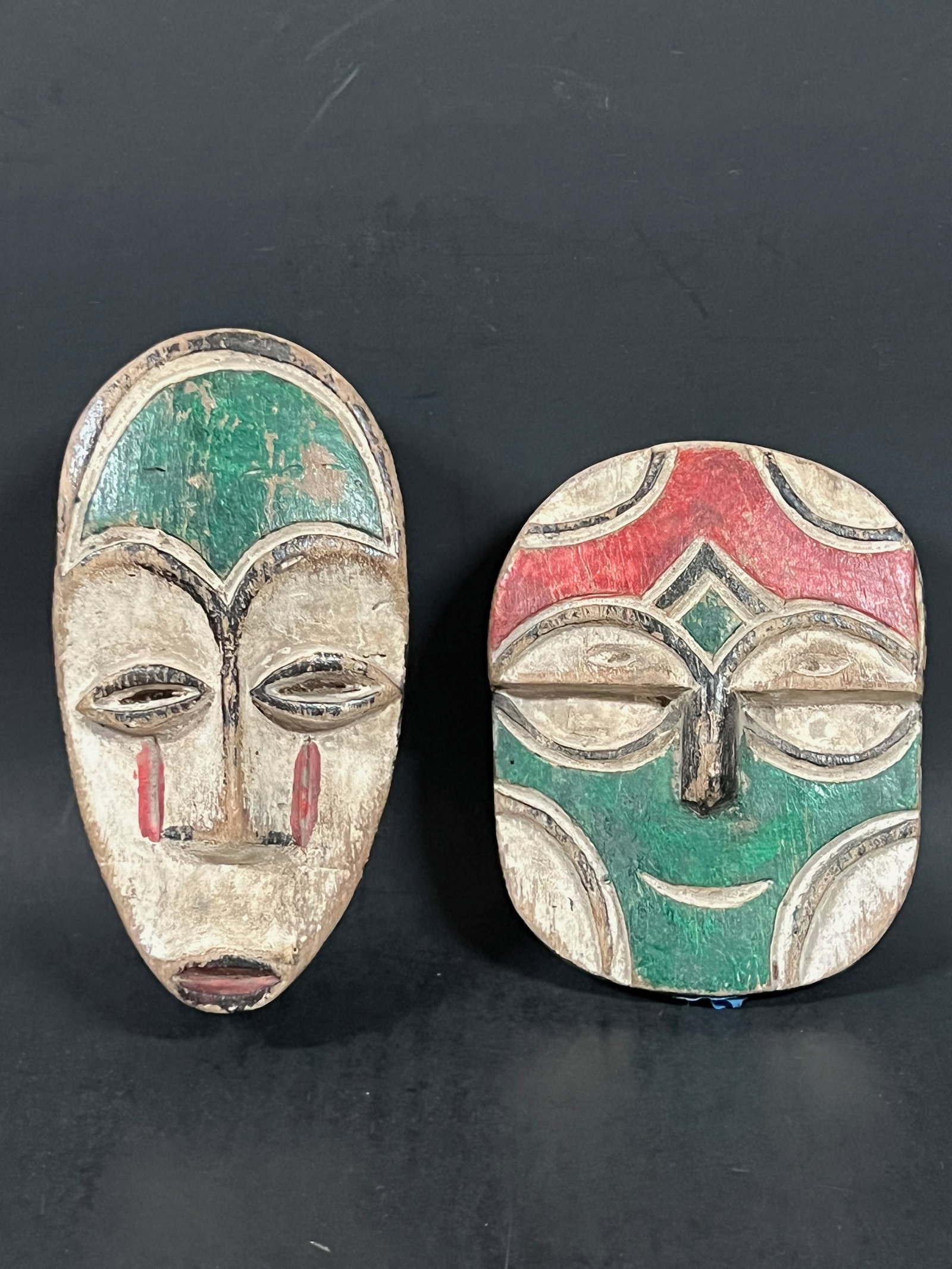 African Art Carved Wood Passport Mask Lot of 2: Title: African Art Carved Wood Passport Mask Lot of 2 Description: African Art Carved Wood Passport Mask Lot of 2 Date/Period: Late 20th Century Materials: Wood Size: 6.5" h x 4" w Reserve: $80.00