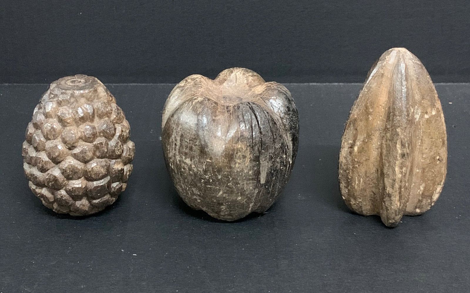Carved Wood Fruits Sculpture Set of 3: Title: Carved Wood Fruits Sculpture Set of 3 Description: Carved Wood Fruits Sculpture Set of 3 Date/Period: Late 20th Century Materials: Wood Size: 3" h x 2" w Reserve: $60.00 Shipping: Domestic: