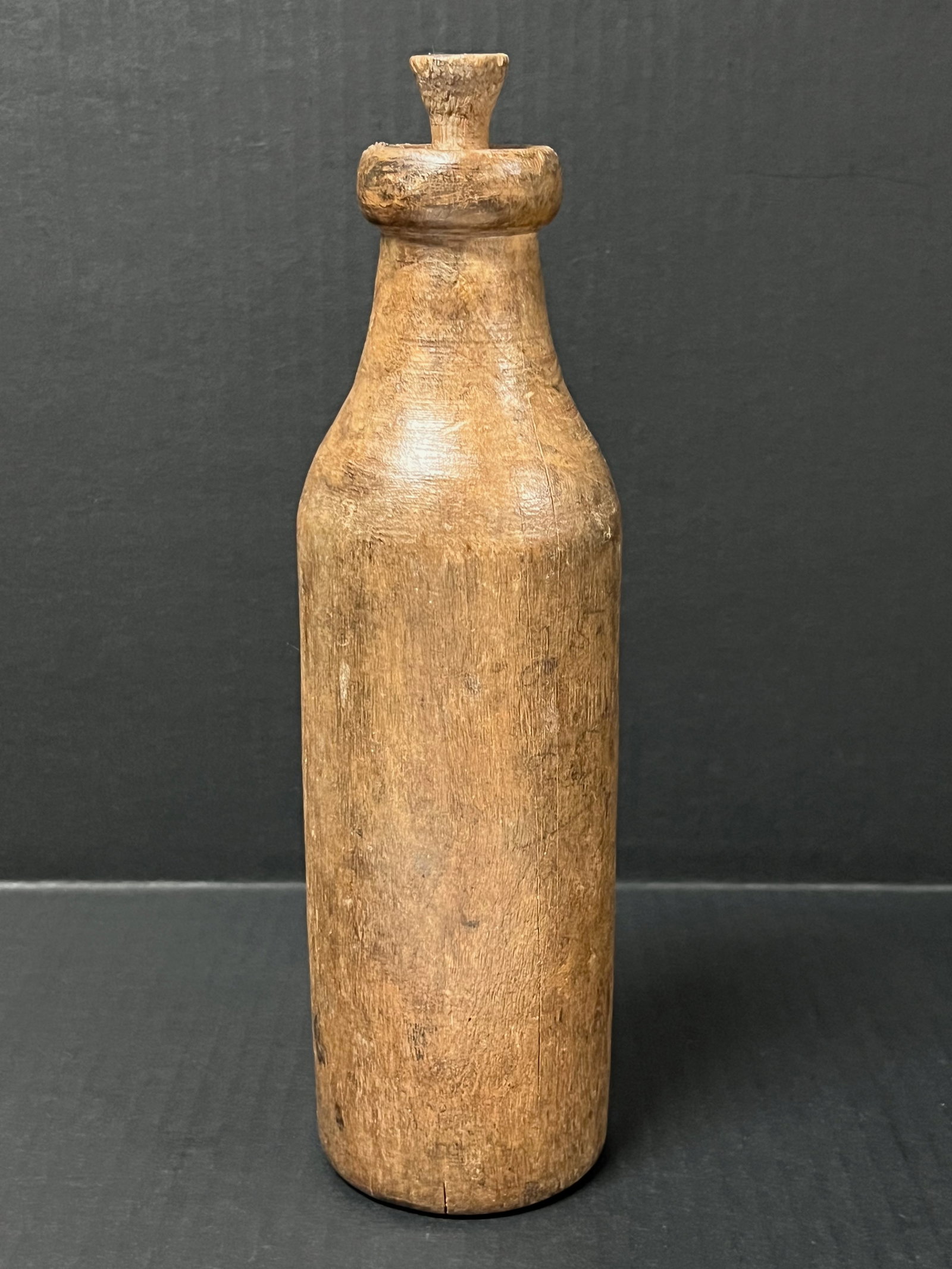 Carved Wood Bottel Sculpture: Title: Carved Wood Bottel Sculpture Description: Carved Wood Bottle Sculpture Date/Period: Late 20th Century Materials: Wood Size: 11" h x 3" w Reserve: $40.00 Shipping: Domestic: Flat-rate of $20.00
