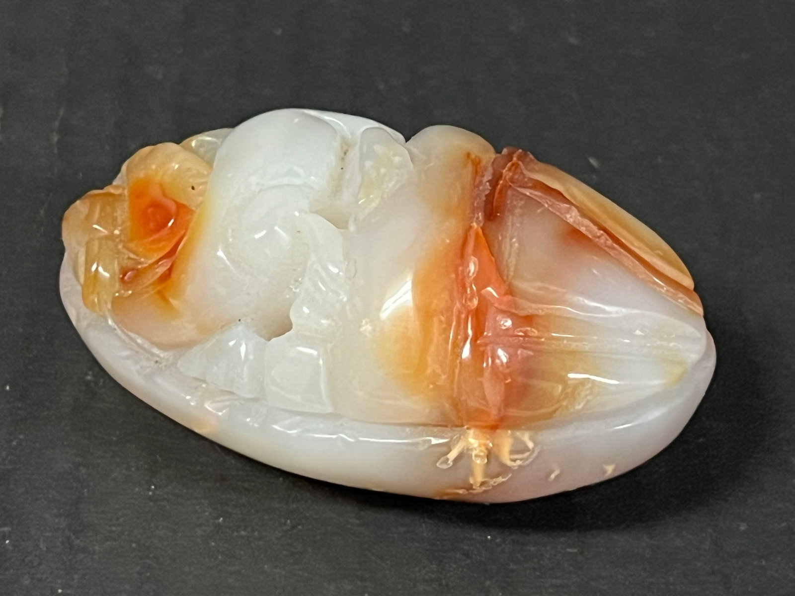 Carved Agate Healing Stone: Title: Carved Agate Healing Stone Description: Carved Agate Healing Stone Date/Period: Late 20th Century Materials: Stone Size: 2" h x 3" w Reserve: $40.00 Shipping: Domestic: Flat-rate of $20.00 to a