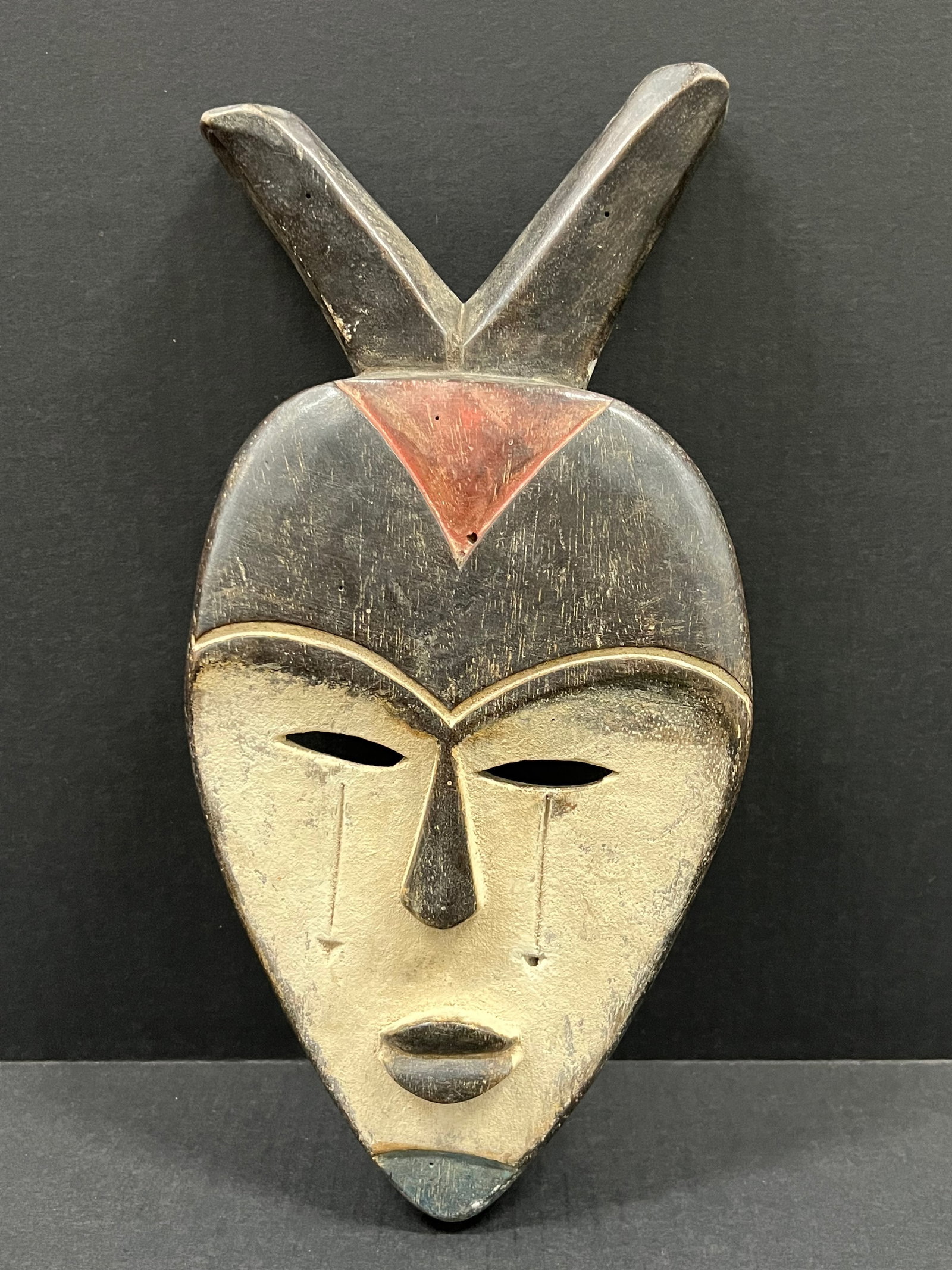 African Tribal Art Vuvi Mask: Title: African Tribal Art Vuvi Mask Description: African Tribal Art Carved Wood Vuvi Mask Date/Period: Late 20th Century Materials: Wood Size: 12" h x 6" w Reserve: $80.00 Shipping: Domestic: