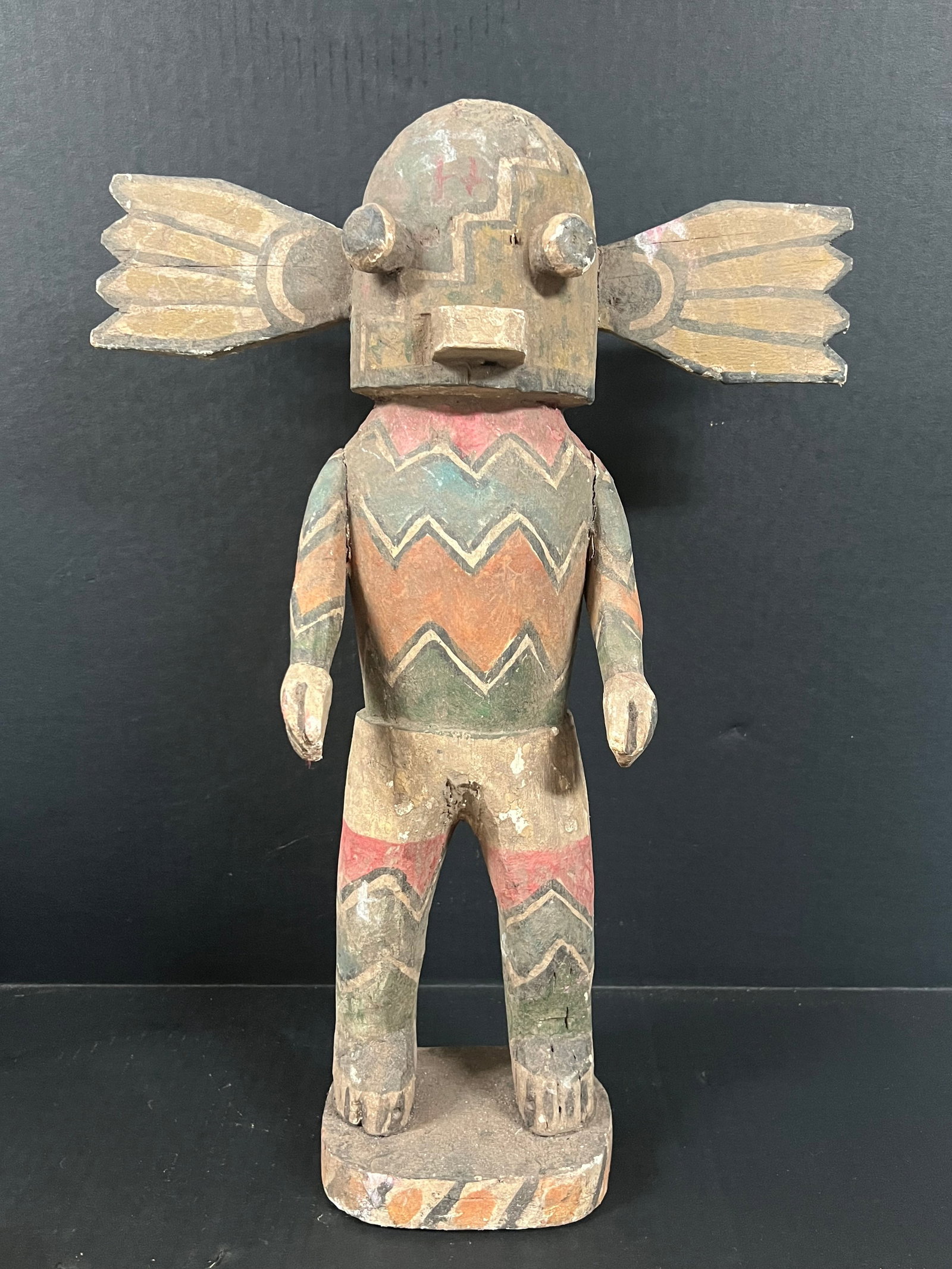 Carved Wood Kachina Doll: Title: Carved Wood Kachina Doll Description: Carved Wood Kachina Doll Date/Period: Late 20th Century Materials: Wood Size: 19.5" h x 14.5" w Reserve: $300.00 Shipping: Domestic: Flat-rate of $60.00