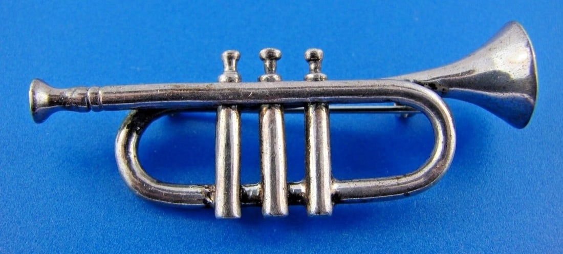 MUSICAL Sterling Silver Trumpet Brooch: Title: MUSICAL Sterling Silver Trumpet Brooch Description: DK Sterling Silver Trumpet Brooch · This is a must for any collector. · The weight is 11.6 grams. The length is 2 1/8 inches. The