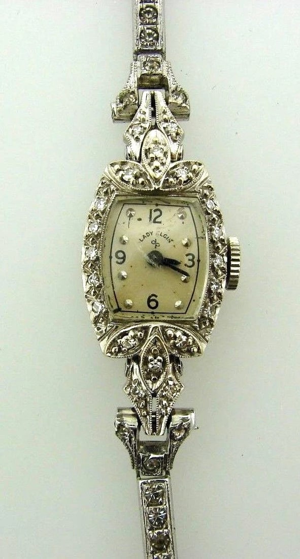 Lady Elgin 14k White Gold: Title: Lady Elgin 14k White Gold Description: N-TOO LADY ELGIN 14K WHITE GOLD STERLING SILVER DIAMOND WATCH BEZEL 14 MM X 20 MM FACE 10 MM X 12 MM WEIGHT 15.4 G LENGTH 5 3/4'' WIDTH UP TO 5/16'' . DIA