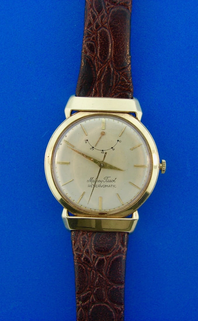 Mathey-Tissot 14k Yellow Gold Reservomatic Stamped Leather Wristwatch Watch: Title: Mathey-Tissot 14k Yellow Gold Reservomatic Stamped Leather Wristwatch Watch Description: AK E00 Mathey-Tissot 14k Yellow Gold Reservomatic Crocodile Stamped Leather Wristwatch Watch ·