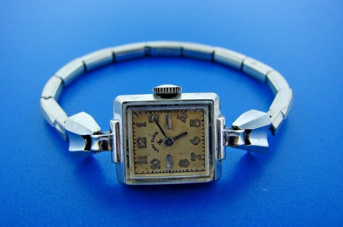 TIMELESS ELgin 14k White Gold Lady's Watch: Title: TIMELESS ELgin 14k White Gold Lady's Watch Description: DK Elgin 14k White Gold Lady’s Watch · This is a must for any collector. · The weight is 15.1 grams. The length is 5.50