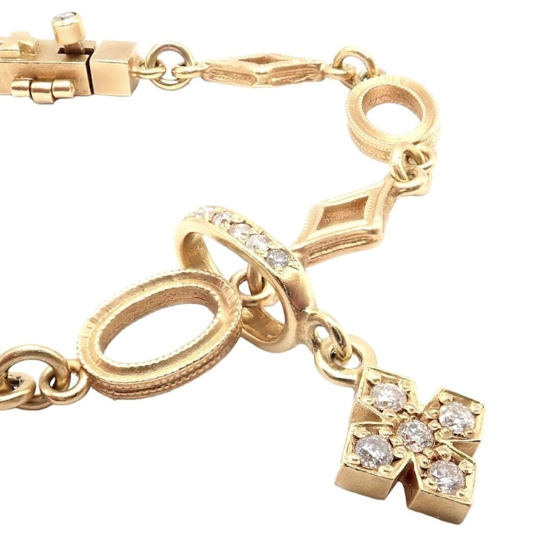 Rare Loree Rodkin 18k Yellow Gold Diamond Cross Bracelet: Rare Loree Rodkin 18k Yellow Gold Diamond Cross Bracelet Rare Loree Rodkin 18k Yellow Gold Diamond Cross Bracelet Product Description About This Piece: Loree Rodkin is a renowned jewelry designer who