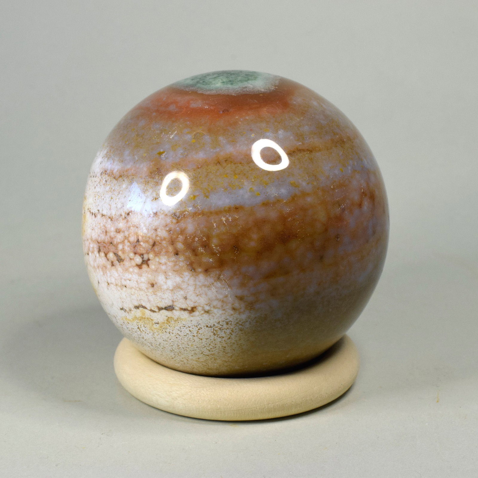 6.9 cm Polished Ocean Jasper sphere: Title: 6.9 cm Polished Ocean Jasper sphere Origin: Madagascar Size: 6.9 cm diameter Description: Species: Jasper (Ocean Jasper) Locality: Madagascar Diameter: 6.9 cm Weight: 0.44 kg Fine polished