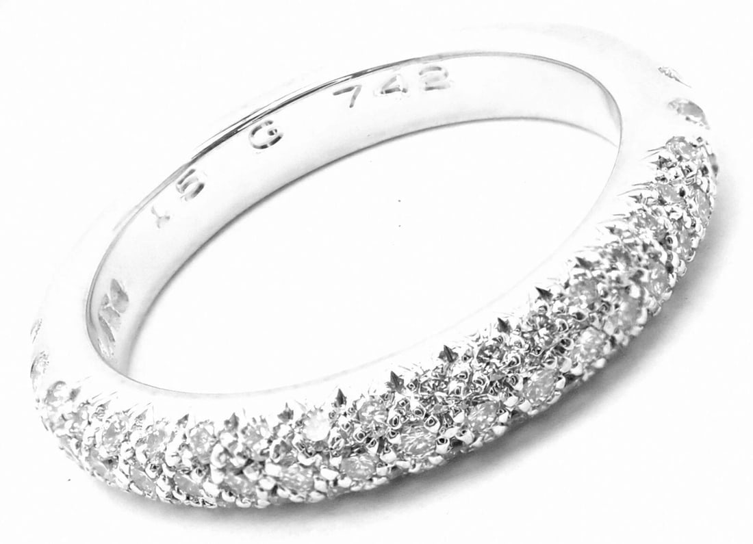 Authentic! Chanel 18k White Gold Diamond Band Ring: Authentic! Chanel 18k White Gold Diamond Band Ring About This Piece: Metal: 18k White Gold Measurements: Size:6 Width: 4mm Weight: 5.4 grams Stones: Round Brilliant Cut Diamonds VVS1 clarity, E color 
