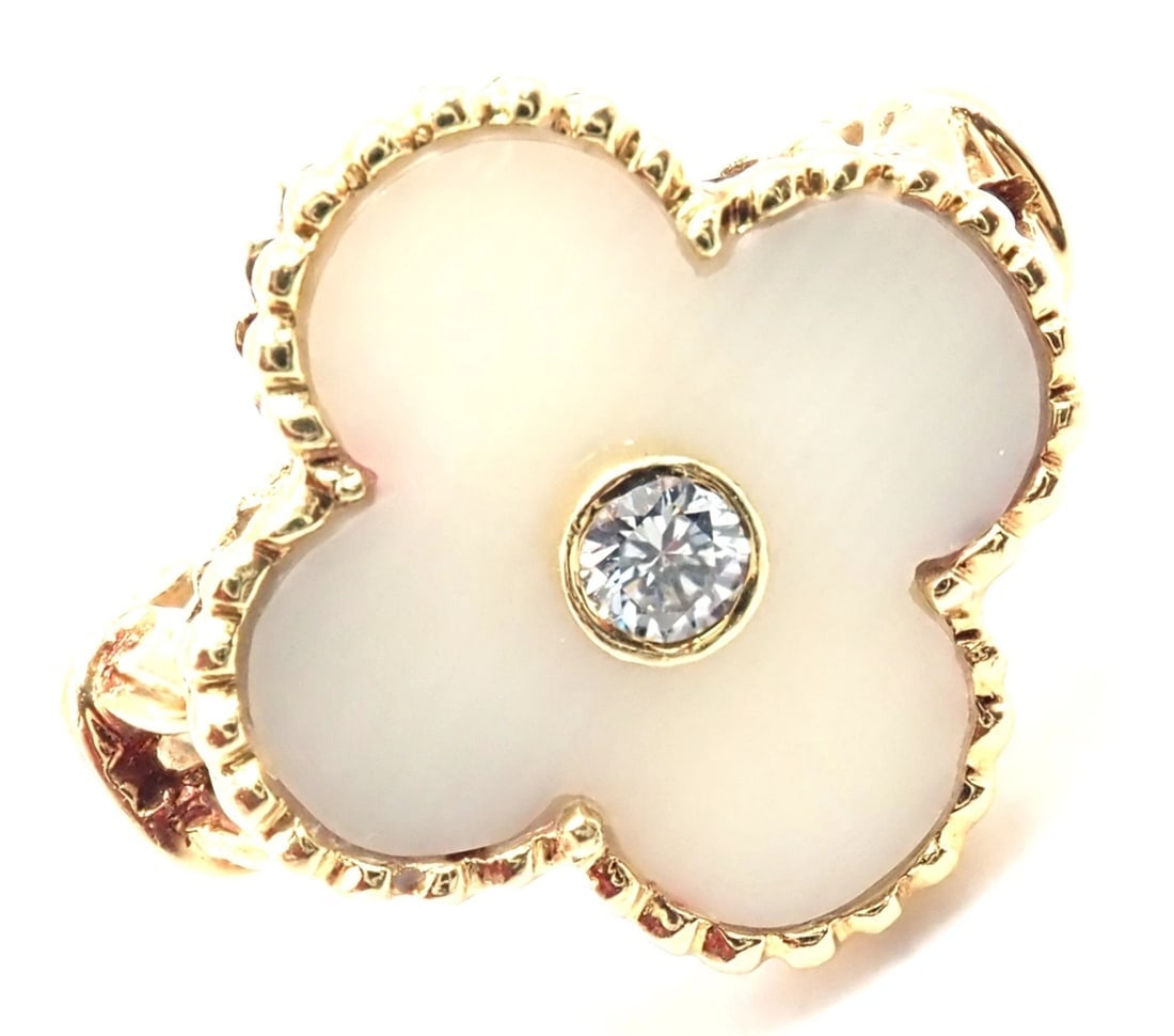 Van Cleef & Arpels Vintage Alhambra 18k Yellow Gold Diamond White Coral Ring: Van Cleef & Arpels Vintage Alhambra 18k Yellow Gold Diamond White Coral Ring About This Piece: This ring comes with service paper from a VCA store. Metal: 18k yellow gold Measurements: Size - 4.75