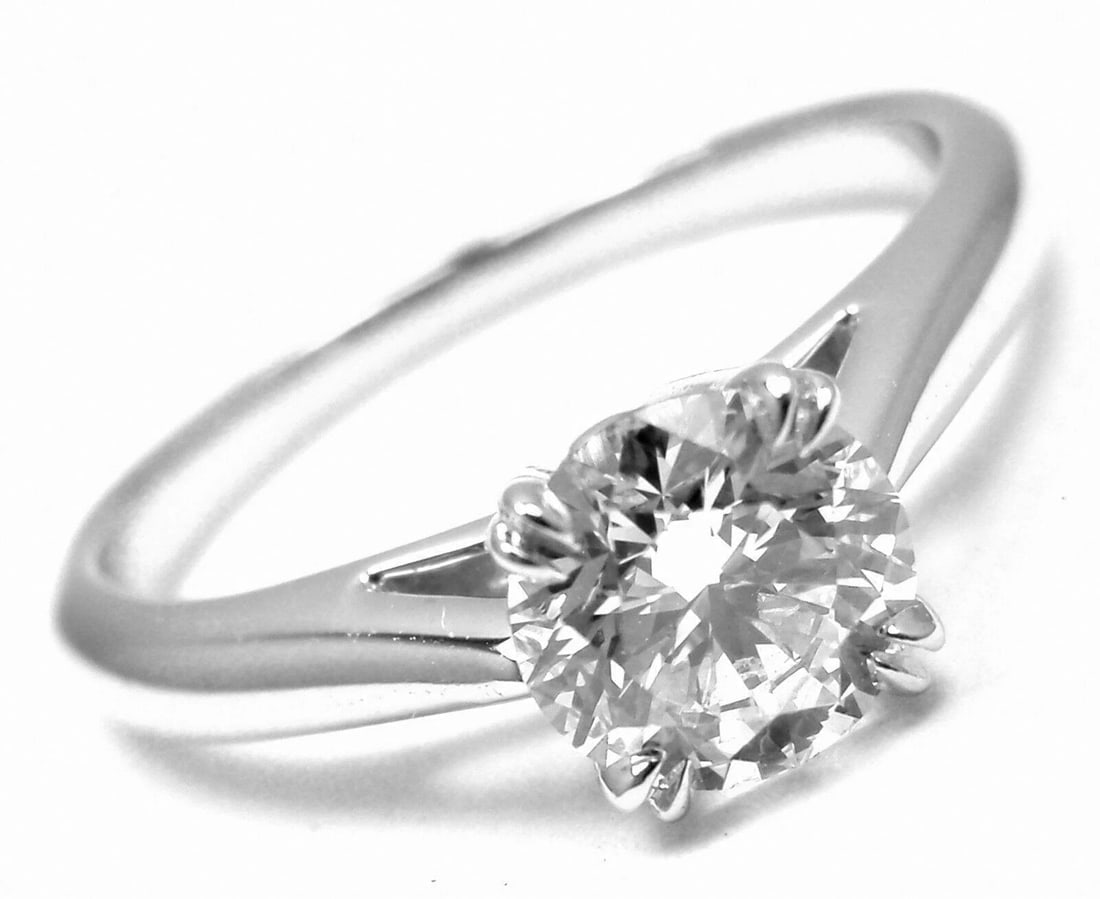 Authentic! Harry Winston Platinum .56ct VVS1/F Diamond Solitaire Engagement Ring: Authentic! Harry Winston Platinum .56ct VVS1/F Diamond Solitaire Engagement Ring About This Piece: Metal: Platinum Size: 3.5 Weight: 2.9 grams Stones: 1 round brilliant cut diamond VVS1 clarity F