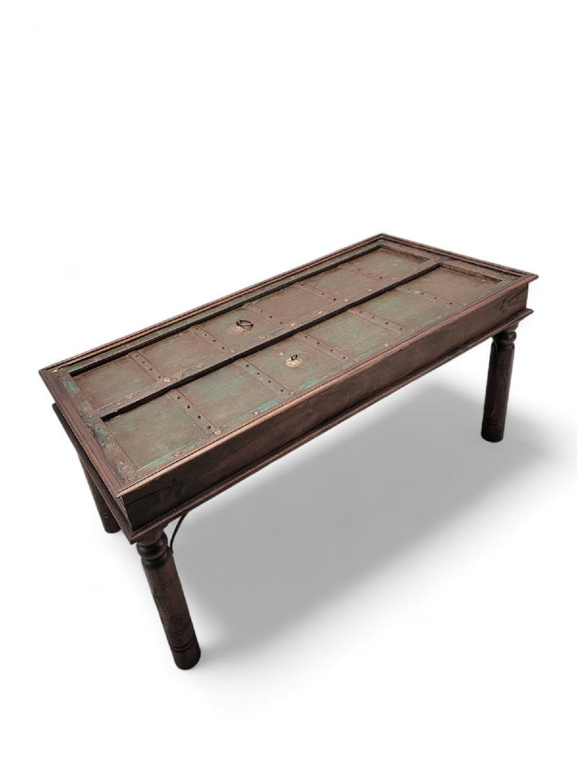 Antique Rustic Table Crafted from Historic Indian Door: Materials: wood, ironWidth: 66 inchesHeight: 30.75 inchesDepth: 31 inchesAntique Rustic Table Crafted from Historic Indian DoorBring exceptional character and global craftsmanship into your home with
