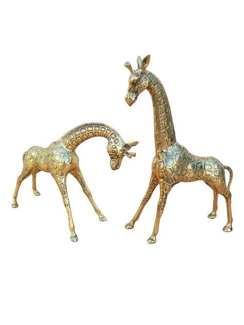 Vintage Brass Giraffe Statues - Set of 2: Vintage Brass Giraffe Statues - Set of 2Circa Mid 20th Century DimensionsGiraffe 1H 19”W 14”D 4”Giraffe 2H 13”W 19”D 4”CONDITION: Please be aware that all items