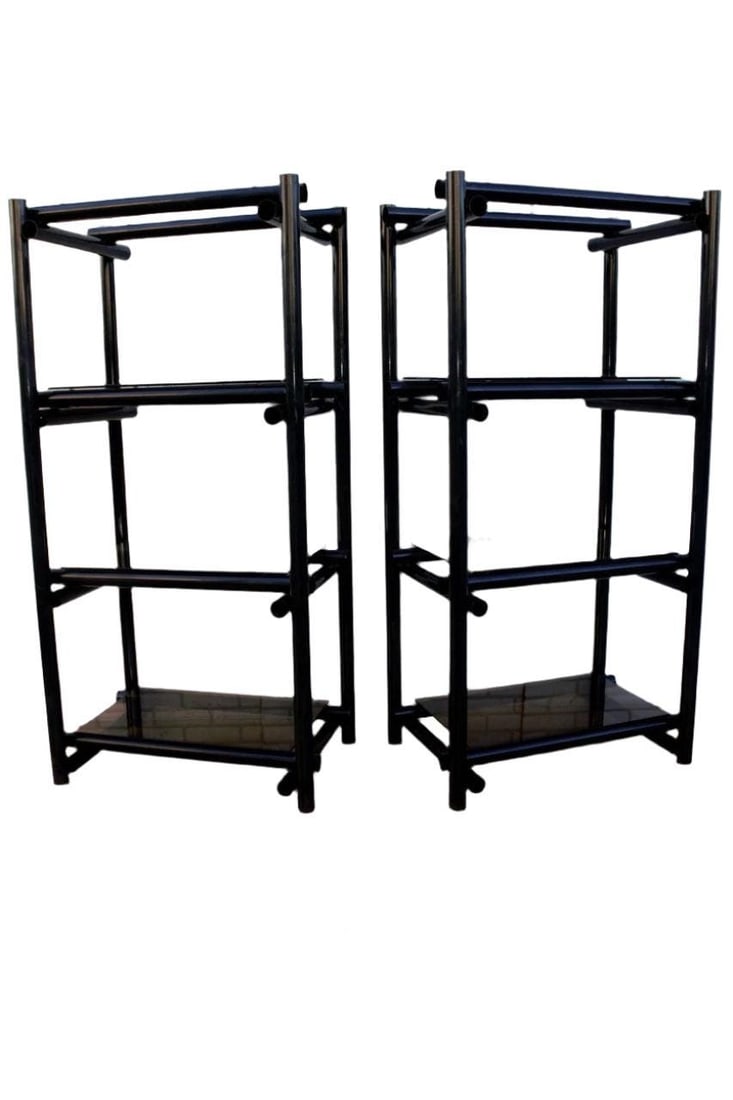 Vintage Modernist Shelving Units/Etagere - Pair: Vintage Modernist Tubular Black Metal Shelving Units/Etagere with Tinted Glass - PairThese etageres capture the classic materials of modernism with their dark metal and tinted glass. Each shelf has fo