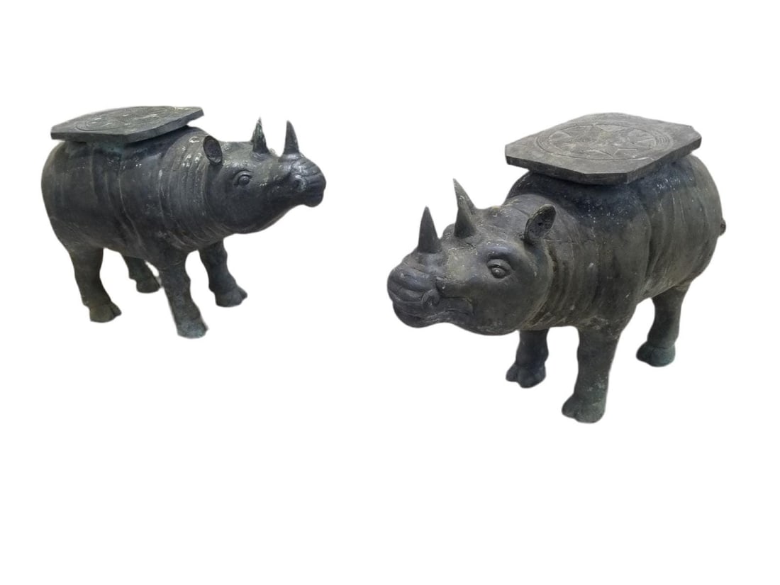Antique Balinese Hammered Bronze Saddled Rhino Table - Set of 2: Antique Balinese Hammered Bronze Saddled Rhino Plant Stand/Cocktail Table - Set of 2These two Balinese antique rhino sculptures and their expertly crafted features would be beautiful additions to an