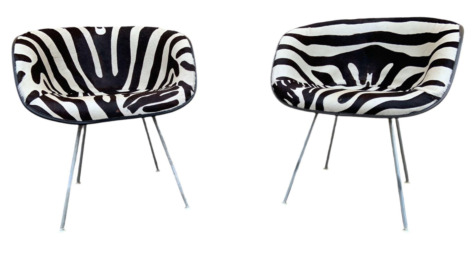 MCM La Fonda Chairs by Herman Miller Newly Reupholstered - Pair: .Mid Century Modern Eames La Fonda Chairs by Herman Miller Newly Upholstered in Zebra Print Cowhide - PairThis pair of mid century modern Eames for Herman Miller chairs are mounted on an aluminum