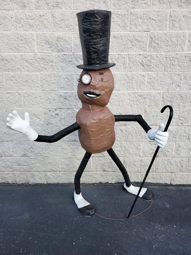 Vintage Oversized Paper Mache Planters Peanut Mr. Peanut Statue: Vintage from the 1980sMaterials: paper macheVintage Oversized Paper Mache Planters Peanut Mr. Peanut StatueCirca End 20th CenturyDimensionsH 72"W 62"D 34"Good vintage conditionCONDITION:Please be