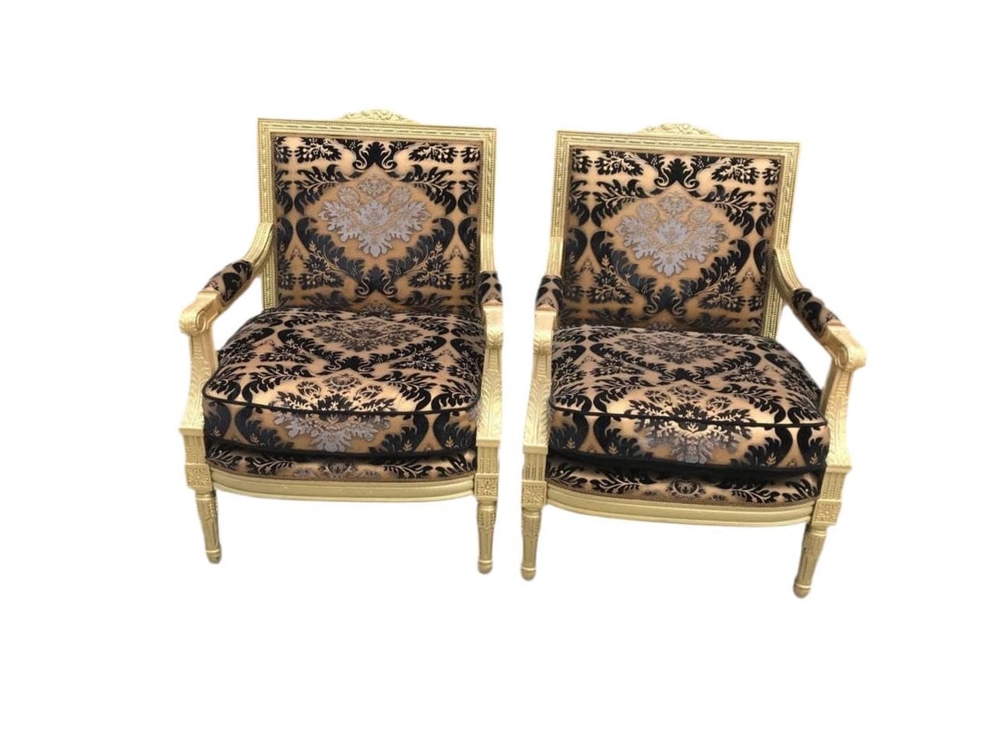 Antique Louis XVI Style Chairs Newly Reupholstered - Pair: Antique Louis XVI Style Armchair with Carved Gold Frame Newly Reupholstered in a Patterned Black with Gold Stenciling Velvet - PairThis elegant antique Louis XVI armchair features a beautifully carved