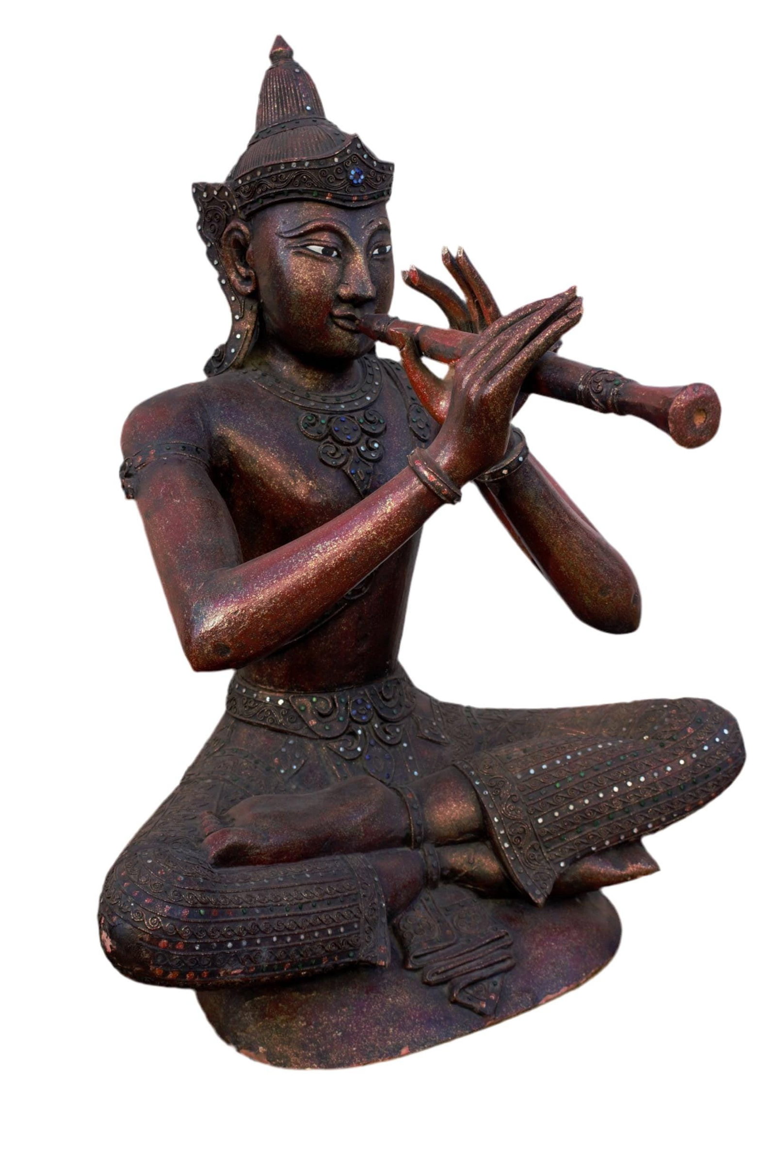 Antique Thai Buddha Statue: Antique Thai Buddha Statue This is an Antique Thai Buddha statue with a triangular base to match his seated lotus position, and he is holding a flute and is colorfully adorned in many mirrors and