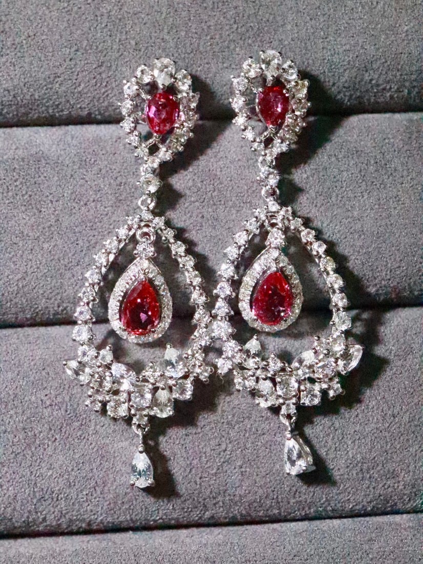 18K Gold Natural Unheated Ruby Earrings: Title: 18K Gold Natural Unheated Ruby Earrings Description: These earrings captivate with their unique courtly style and opulent design. The main stone is an unheated ruby, exuding a captivating brill