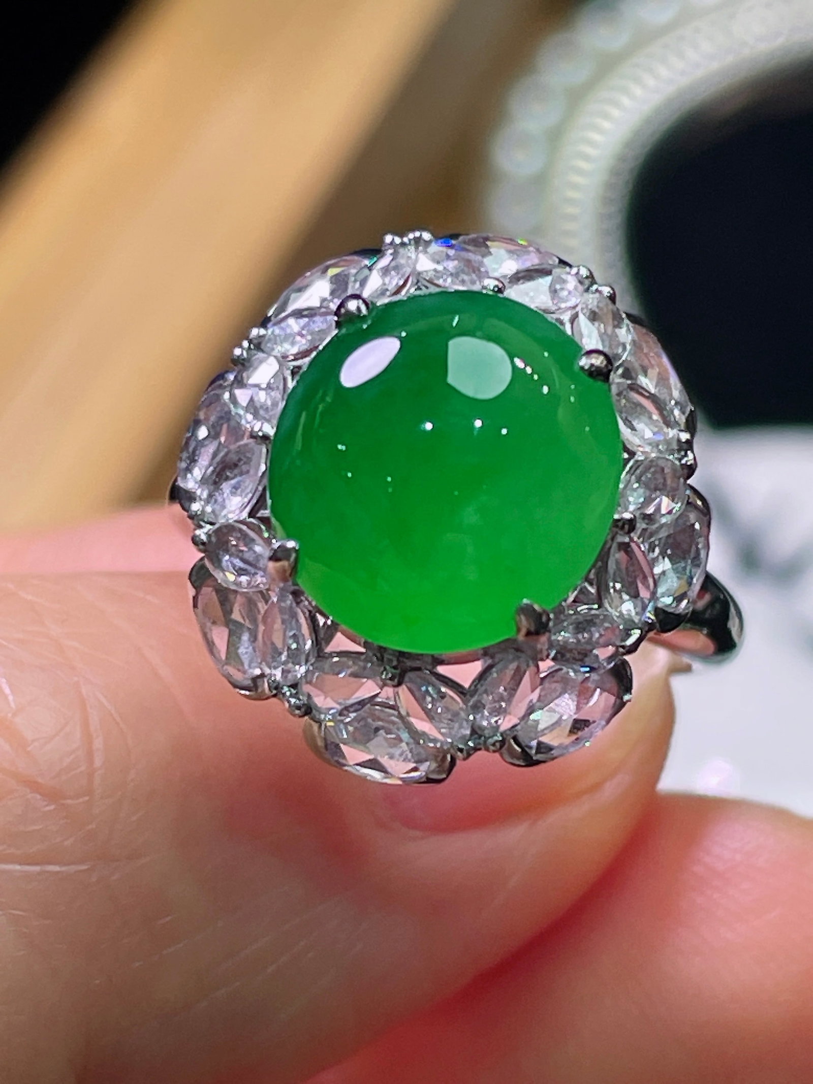 18K Gold Natural Jadete Ring: Title: 18K Gold Natural Jadete Ring Description: This ring is meticulously set in 18K gold, perfectly showcasing the exquisite and vibrant jadeite. Diamond accents add a touch of luxury, making it a