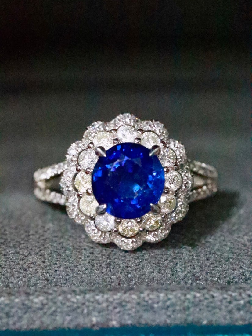 Platinum Natural Sapphire Ring: Title: Platinum Natural Sapphire Ring Description: This platinum sapphire ring showcases a rich color and elegant brilliance, with a stunning crystal. The addition of diamonds enhances its overall