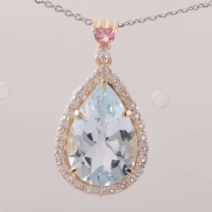 5.20 Ct Pear Aquamarine 9K Gold Pendant: 5.20 Total Carat Aquamarine 9K Gold Pendant Specifications: Total Weight 2.299 g Center Gemstone Aquamarine Gemstone Carat Weight 4.56 Carats Gemstone Measurements 15.10X10.10X6.10 mm Additional Gemst