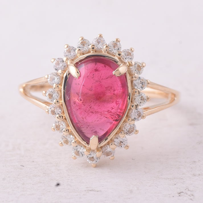 3.52 Ct Pear Tourmaline 9K Gold Ring: 3.52 Total Carat Tourmaline 9K Gold Ring Specifications: Total Weight 2.726 g Center Gemstone Tourmaline Gemstone Carat Weight 2.96 Carats Gemstone Measurements 10.50X7.50X4.80 mm Additional Gemstones