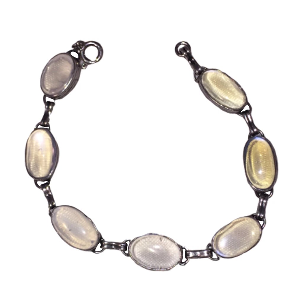 Art Deco Sterling Oval Hand Cut Grey Moonstone Bracelet: Title:Art Deco Sterling Oval Hand Cut Grey Moonstone Bracelet Description:Art Deco hand made sterling oval hand cut grey moonstone bracelet, lovely engraved bezels. Circa 1930's. Measures 7 1/2" long 