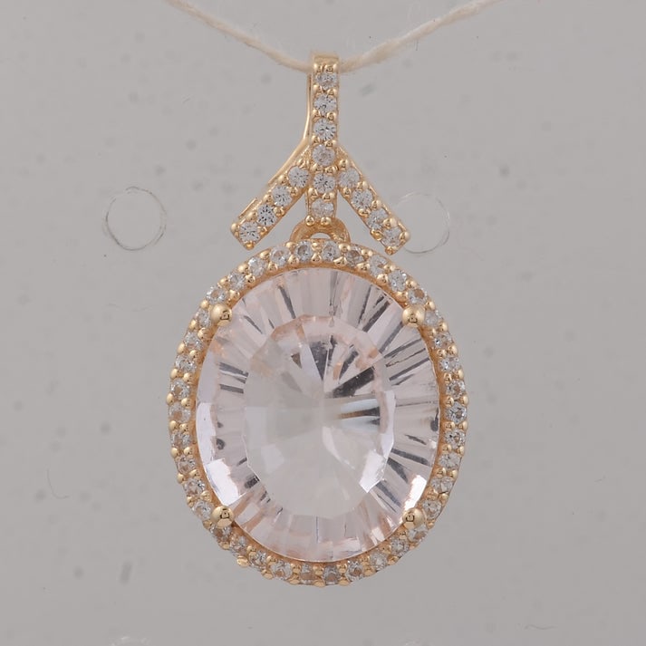 3.66 Ct Oval Morganite 9K Gold Pendant: 3.66 Total Carat Morganite 9K Gold Pendant Specifications: Total Weight 1.94 g Center Gemstone Morganite Gemstone Carat Weight 3.42 Carats Gemstone Measurements 12X10X5.40 mm Additional Gemstones Whit