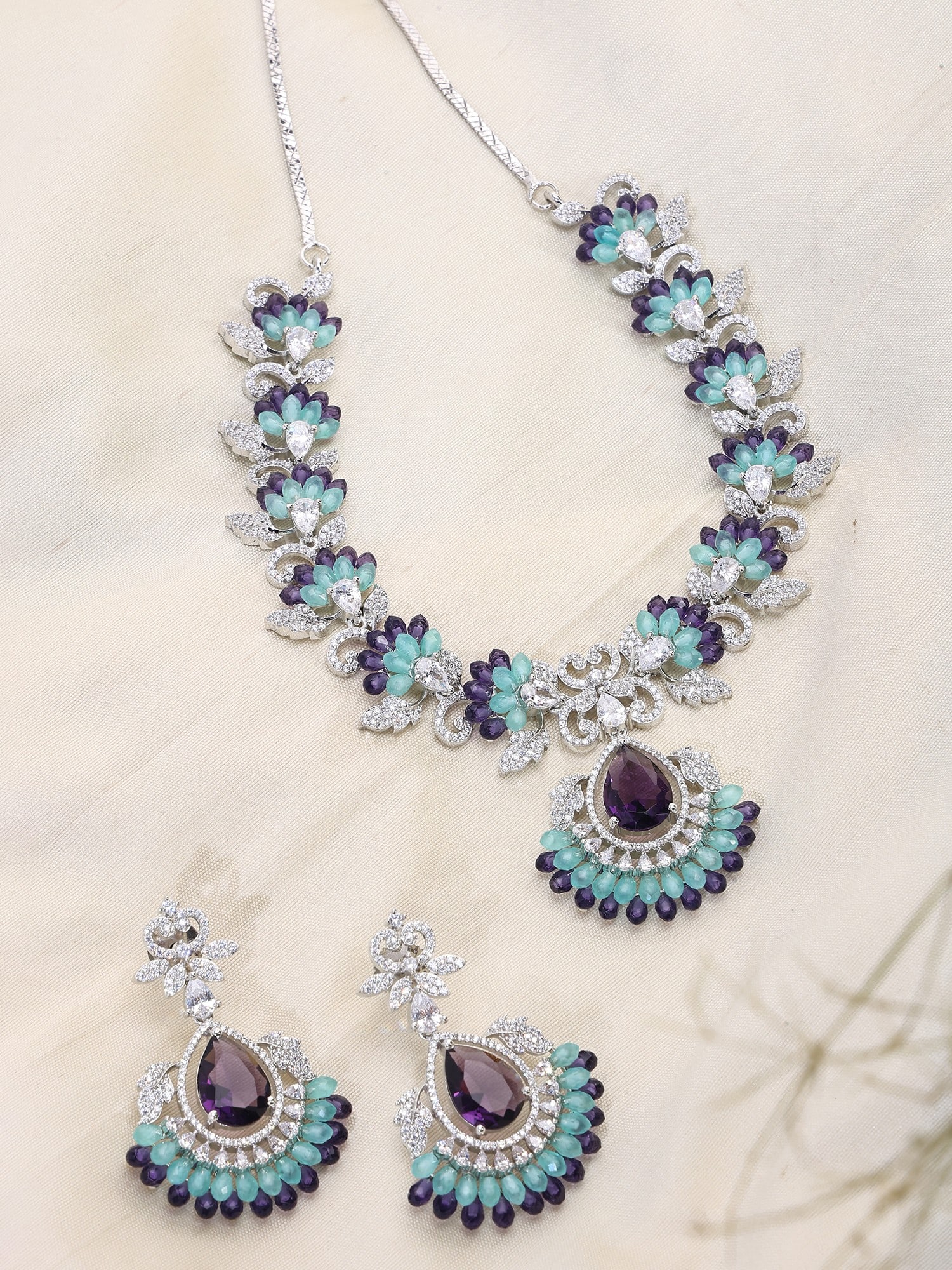 Leaf Design Stone Studded American Diamond Necklace Set: Title:Leaf Design Stone Studded American Diamond Necklace Set Reference:itemcode : JA0683-purpleblue Reserve: $140.00 Shipping: Domestic: Shipping rates are determined by destination International: Fo