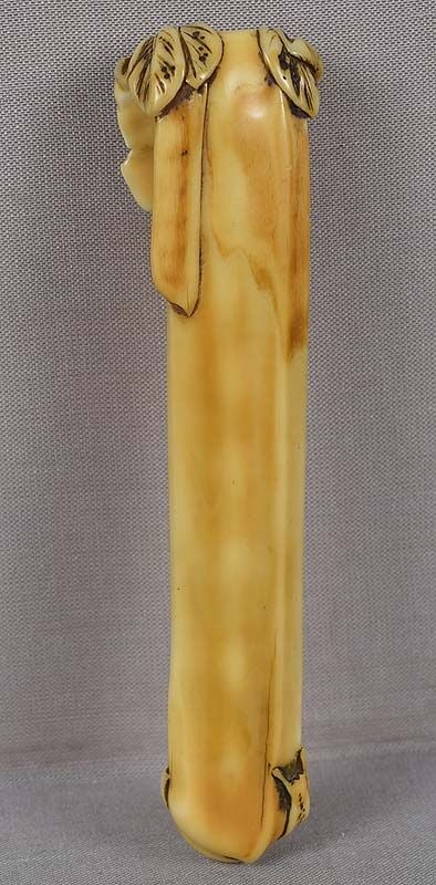 19c marine OBIHASAMI netsuke SNAIL & gourd: Very unusual 19th century marine netsuke of obihasami type, the upper hook carved as leaves of a vine holding a long pod, and the lower hook as a snail starting to climb up the body of the netsuke. Th