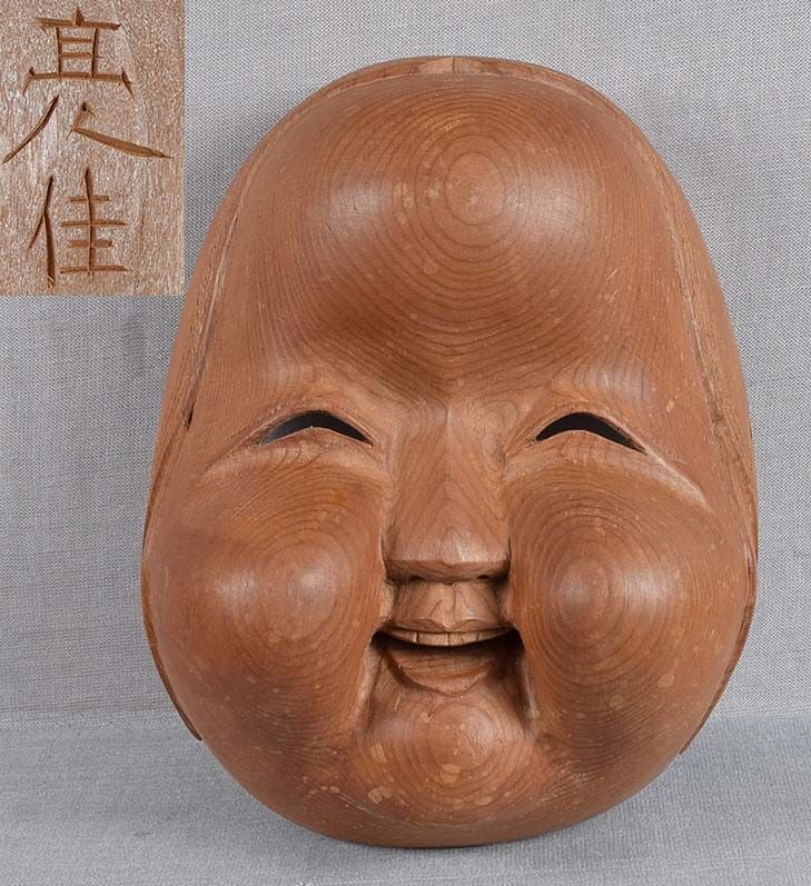 1900s Japanese mask OKAME by netsuke carver SUKEZUMI: Late Meiji - early Taisho (1900-1920) okimono size wooden mask of smiling Okame. Wonderfully captured facial expression, cleverly exaggerated cheeks sticking out, great quality carving typical for