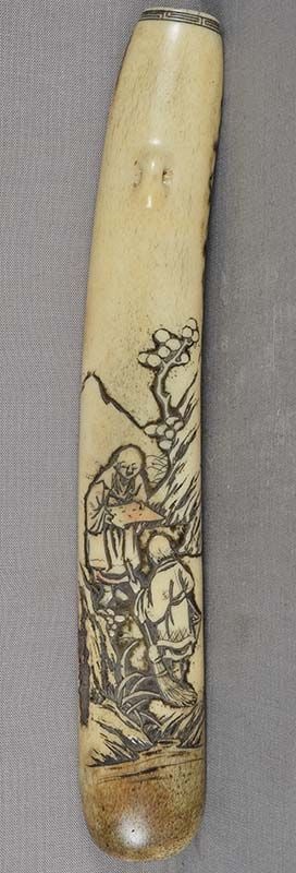 19c ASAKUSA KISERUZUTSU Japanese pipe case Kanzan & Jittoku: 19th century Japanese Asakusa school staghorn kiseruzutsu - tobacco pipe case - carved with a mountainous landscape and figures of Kanzan reading an open scroll and Jittoku leaning on his broom.