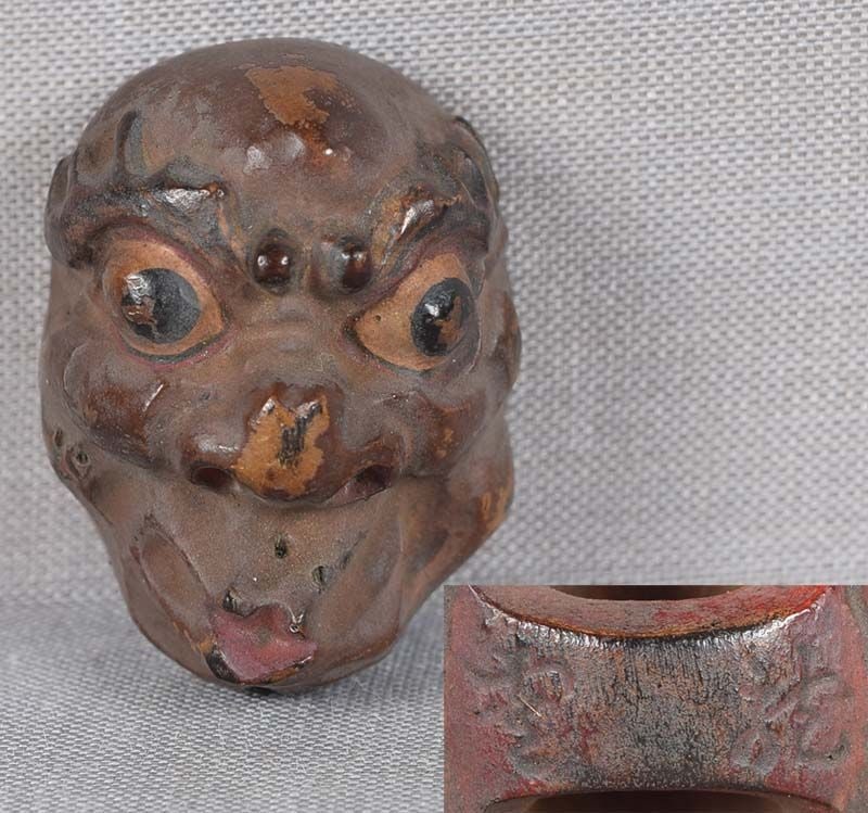 19c netsuke MASK USOFUKI by RYUUN: 19th century Japanese small lacquered wood netsuke representing a theatrical mask of Usofuki with characteristically pursed lips. Crisp detailing, nicely lacquered, great patina. some wear to the surf