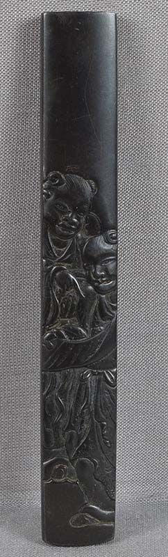 18c Japanese sword KOZUKA Kanzan & Jittoku reading scroll: 18th to early 19th century Japanese bronze kozuka (sword knife) handle with low relief decoration of Kanzan and Jittoku looking at an open scroll. According to a legend, Kanzan and Jittoku lived in a