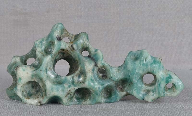 Vintage Chinese scholar BRUSH REST soapstone as Taihu rock: Vintage Chinese soapstone small brush rest carved to represent a Taihu scholar’s rock with numerous perforations and crevices. Beautiful Guangdong green soapstone, extraordinary carving,