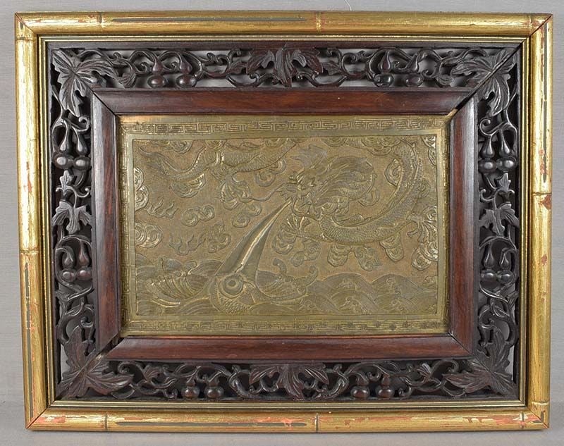 19c Chinese bronze plaque DRAGON in flight: 19th century Chinese bronze f plaque with low relief depiction of a dragon in flight over among swirling clouds above cresting waves, as it exhales its fiery breath towards a monster fish. Very nice