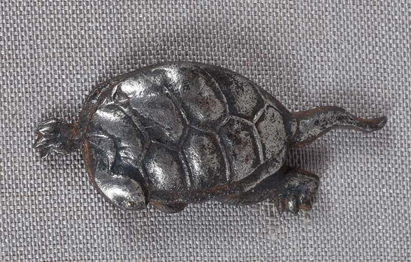19c Japanese sword MENUKI TURTLE: Single early 19th century menuki - Japanese sword fitting - depicting a turtle. Beautiful design, crisp casting and detailing, expert silvering. Length 1.23 inches. Reserve: $100.00 Shipping: