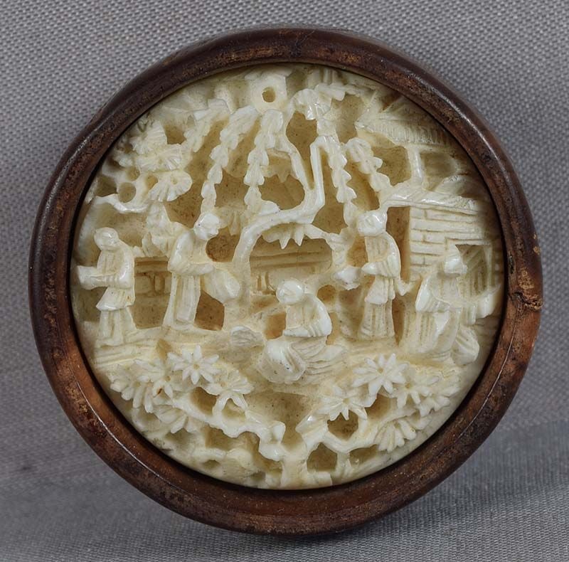 19c netsuke SCHOLARS in garden: 19th century kagamibuta (mirror lid) netsuke, the top being Chinese carving adopted as netsuke, with scene of 5 scholars among various trees and pavilions. Excellent quality work with deep