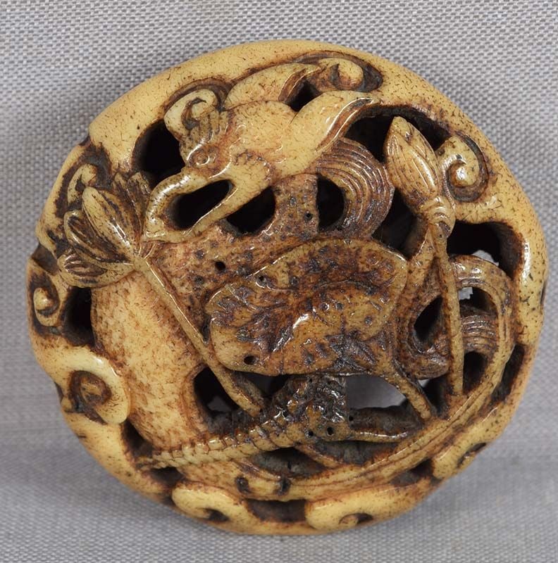 19c staghorn Asakusa netsuke DRAGON among LOTUS: 19th century Asakusa school staghorn netsuke in a ryusa shape with openwork carving of a water dragon among lotus leaves, flowers and buds. Superb design and excellent quality sharp carving,