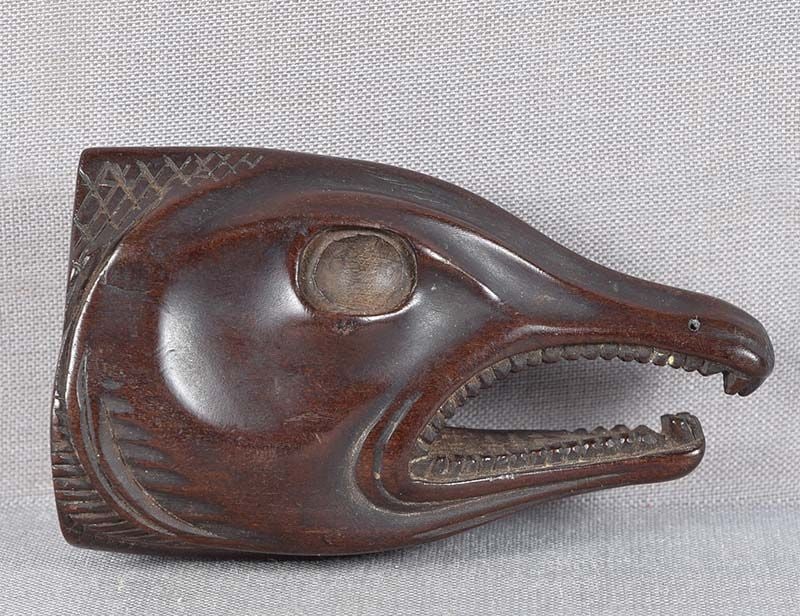 19c netsuke DRIED SALMON HEAD: 19th century boxwood netsuke depicting the head of himono (gutted dried fish). Initially food taken along on a journey, dried fish came to symbolize good luck and health. Beautiful realistic carving