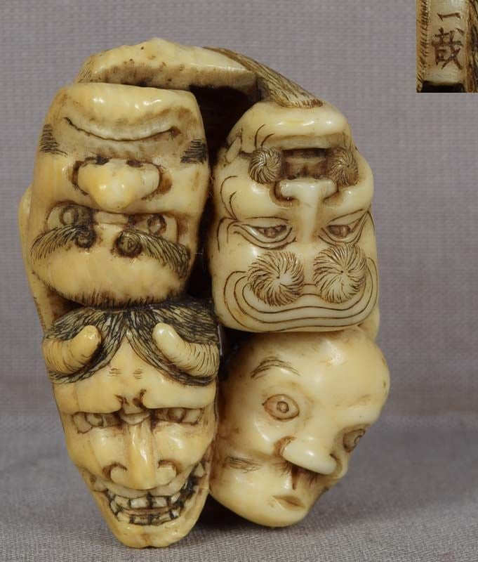 19c netsuke 8 MASKS by ISSAI: 19th century netsuke carved as a cluster of eight theatrical masks, those of Okina, Hannya, Hyottoko, Bishamon, Oni, Ikkaku Sennin, Okame and O-Tobide. Excellent faces, very pleasant feel to the