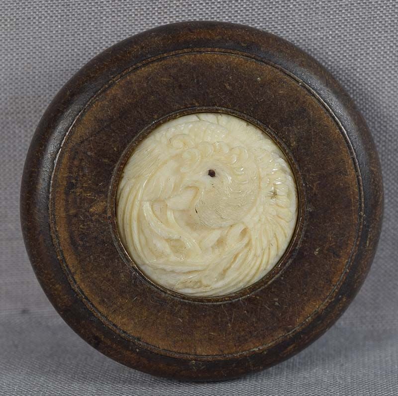 19c netsuke PHOENIX in flight: 19th century netsuke in kagamibuta (“mirror lid”) shape, the top carved with phoenix (the symbol of the Empress) in flight - a motif often seen on textiles. Excellent delicate work, great